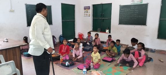 Neglect: Five classes running in one room, teaching and learning difficult
