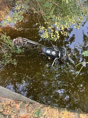 The blood-soaked body of a young man was found on the roadside.