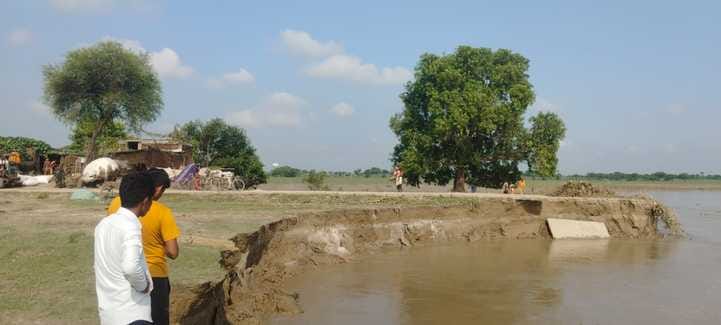 Half of three houses were submerged in the Saryu River.