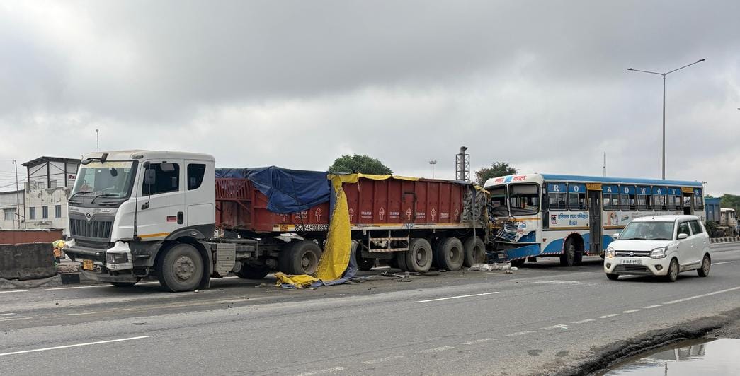 Bus collides with trailer on highway