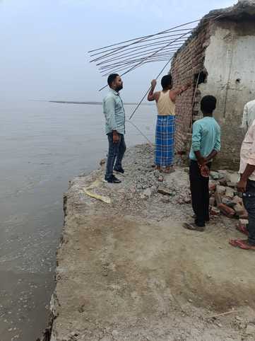 The house was submerged in the Ganges, causing panic in the village.