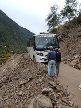 Bus tyre falls off road into ditch, causing commotion