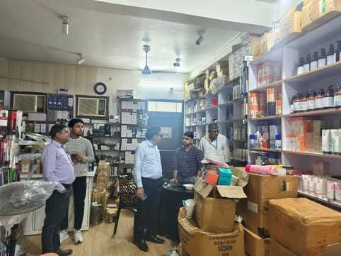 Four city firms selling goods to beauty parlors were raided, with GST evasion worth crores suspected.