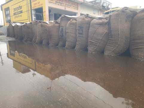 Rain and hailstorms have left paddy in grain markets soaked.