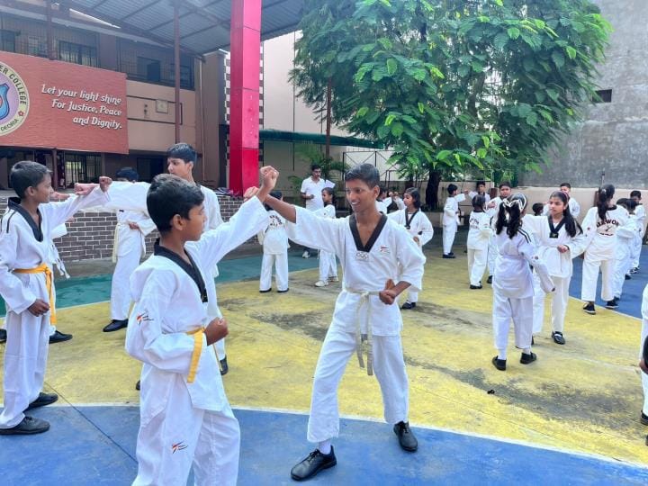 Athletes demonstrated self-defense skills in the Taekwondo belt competition.