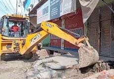 Bulldozer runs on encroachment