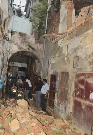 The wall of a dilapidated house collapsed in Khairnagar Dawa Bazaar, with passersby having a narrow escape.