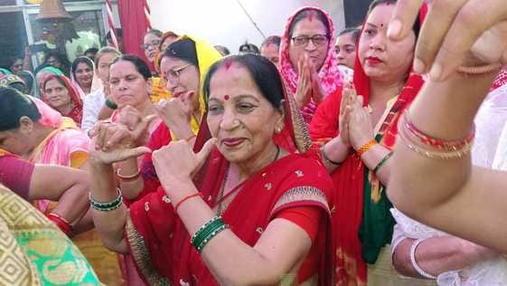 Women danced to the devotional songs of the Goddess at the Sharan Purnima Festival.