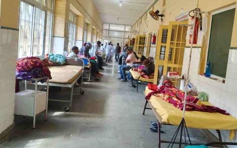 The district hospital has fewer beds for patients, forcing them to seek treatment in the veranda.