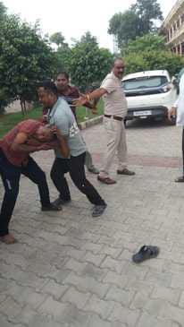 Shopkeeper beaten in front of police in police station