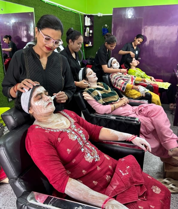Karwa Chauth: Married women apply mehndi with their husband's name on it.