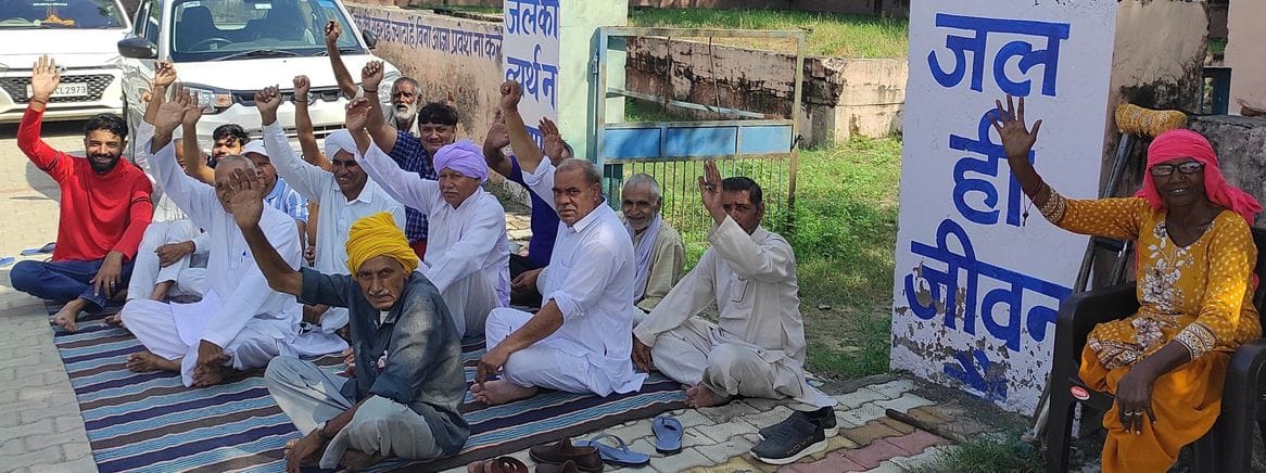 Villagers staged a symbolic protest outside the boosting station, leveling allegations