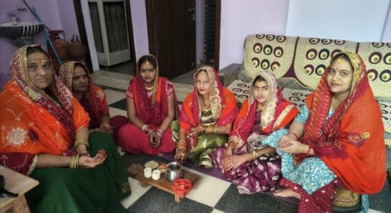 After adorning themselves with sixteen ornaments, the women looked at their moon through a sieve.