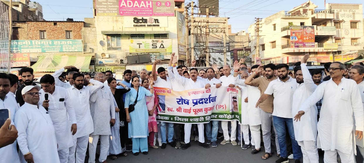 People protested demanding justice for the family of Y Puran Kumar.