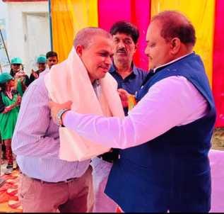 MLA honored teacher Dr. Vinay