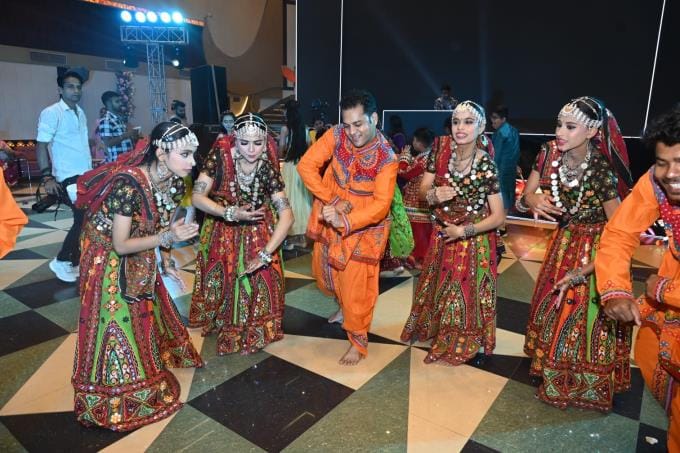 Rotarians danced to the beats of drums and trumpets.