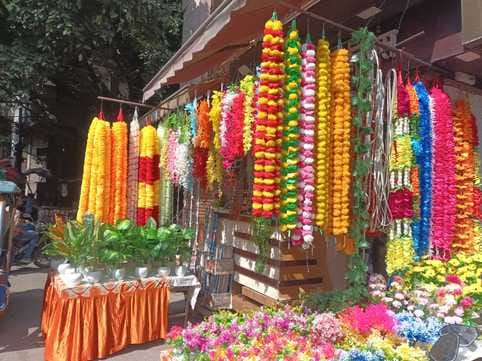 Ferry lights will illuminate homes and shops, and the flower garlands will be as real as ever.