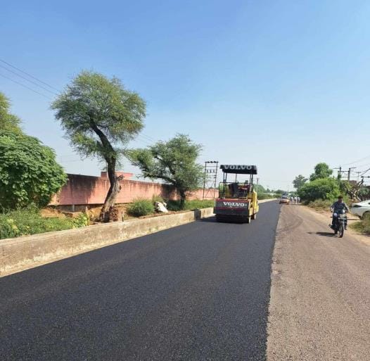 After 13 years, asphalt is being laid on the city's 7-km-long mini bypass.
