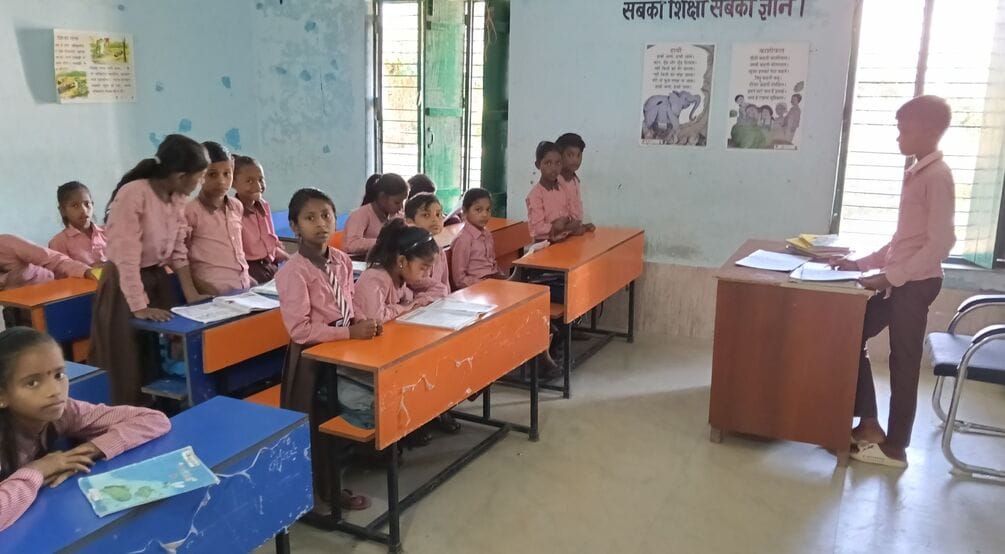 Guruji is undergoing training...children take charge of the education system