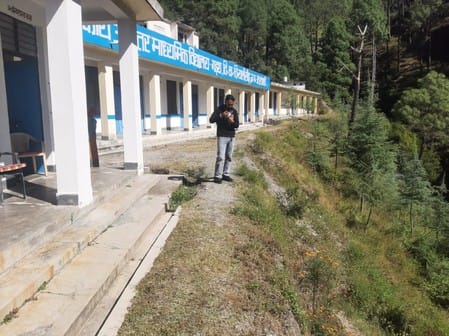 They built a school building, but forgot to build a playground and a security wall.
