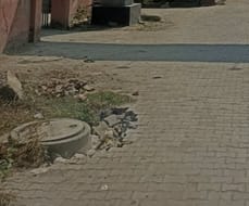 The alley near the entrance of Dutta Colony has collapsed.