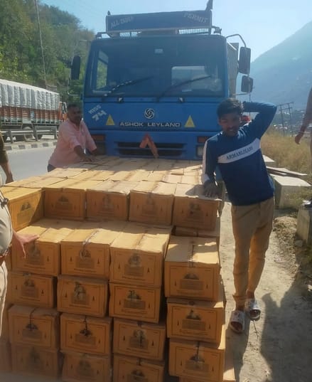 146 cases of liquor being smuggled in a truck loaded with cement were seized.