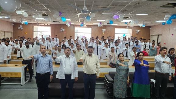 MBBS students were sworn in wearing white coats.