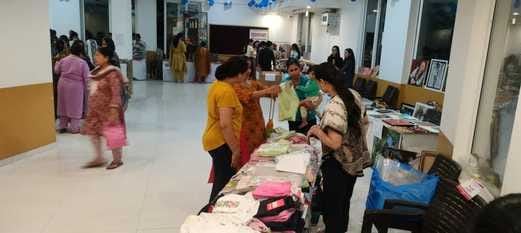 Women set up stalls at the Diwali Carnival