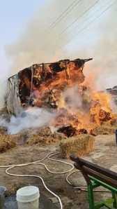 A tractor trolley loaded with stubble bales caught fire in Jhalania.