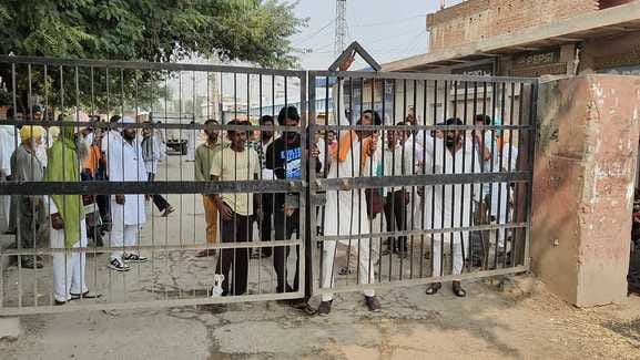 Workers are angry over direct delivery of paddy to mills.