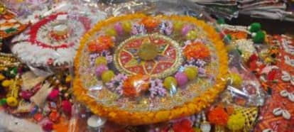 Rangoli made of pearls and cloth flowers is enhancing the beauty of homes