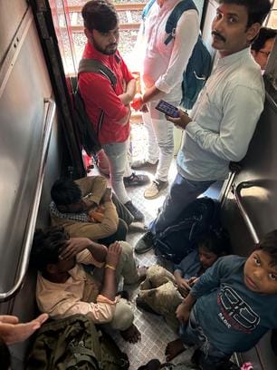 The journey has become difficult... Train seats are full, and people are traveling near the toilets.