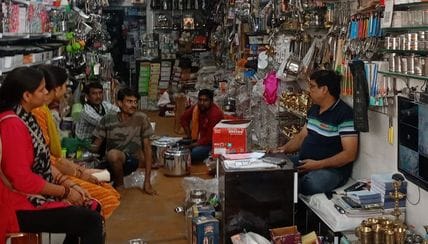 Utensil shops decorated a day before Dhanteras festival, buyers gathered