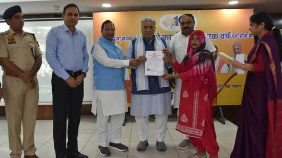 Krishan Lal Panwar hands over plot allotment letters to families of Vaisar village