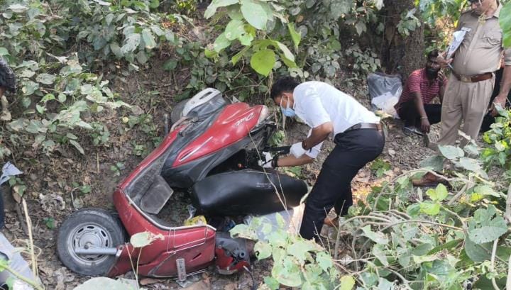 The body of a young man was found buried under a scooter in a six-foot-deep ditch