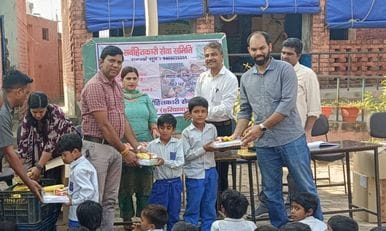 Stationery and fruits were distributed to the children