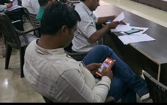 Officer found playing Ludo during Total Solution Day