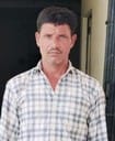 A man carrying a reward of Rs 10,000 on the run for murder was arrested.