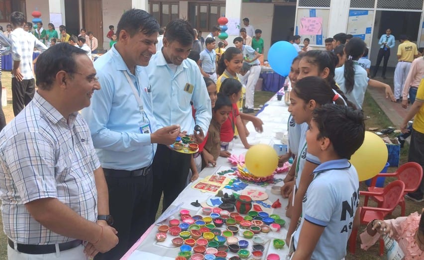 Students set up stalls at the Diwali fair, while staff and parents shopped