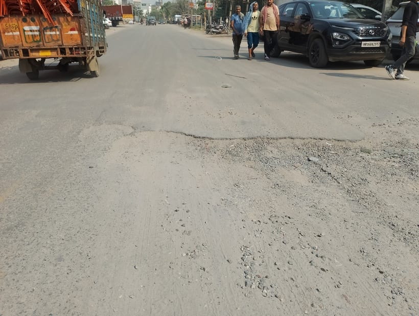 Deep potholes on the road in Sector-25 Part-2