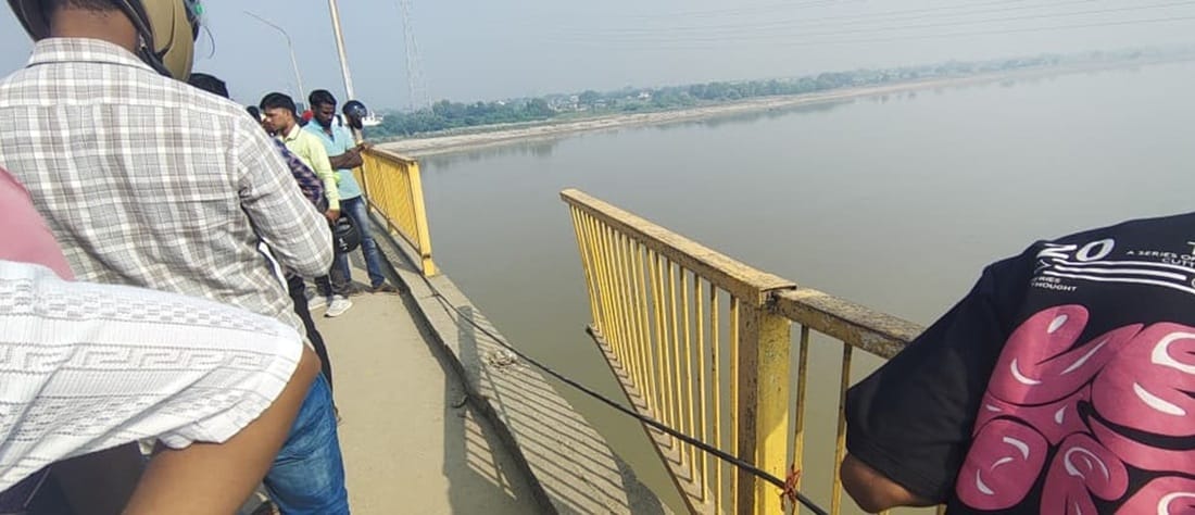 Bridge railing broken, vehicle likely to fall