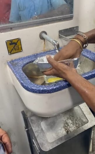 A disgusting game was going on in train, preparing to wash and serve used disposable plates from the dustbin