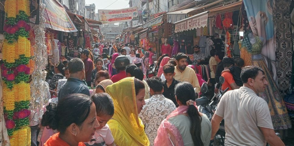 The market is buzzing with the festival of lights, customers buy happiness