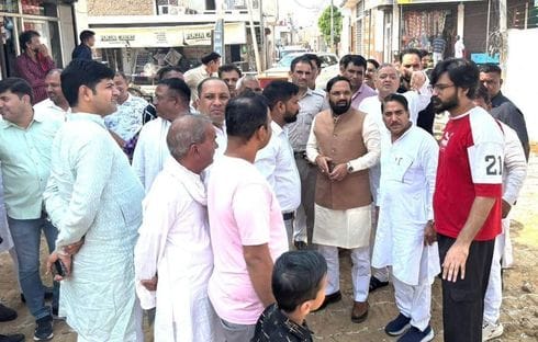 The MLA inspected the street under construction.