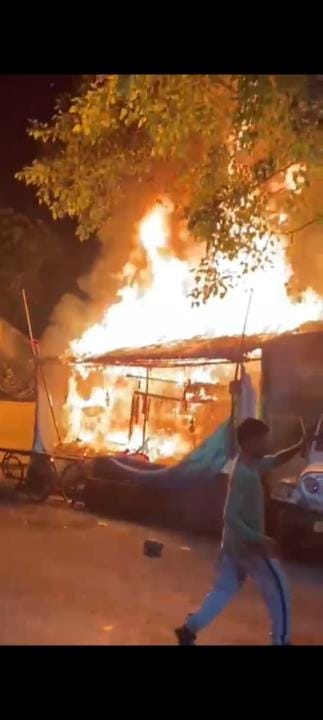 Fire engulfed huts and shops, reducing goods to ashes