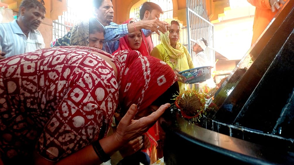 Devotees offered prayers at the Gufa Wale Baba Temple on Diwali.