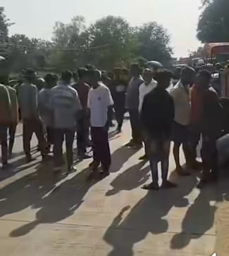 Bike rider dies after being hit by a tractor, family members block the state highway