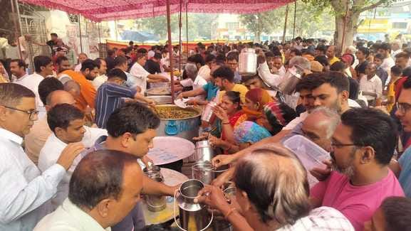 Crowds gathered in temples to receive Annakut Prasad.