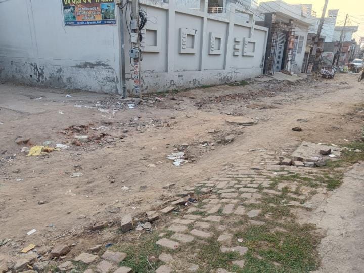The bridge was built, but the service road was blocked, and construction stalled due to the lack of sewer manholes.