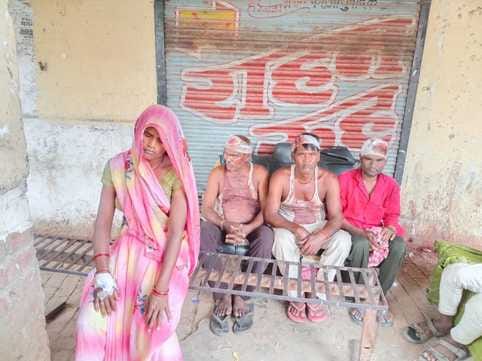 Two groups clashed with sticks over a road and drain dispute, injuring 13 people